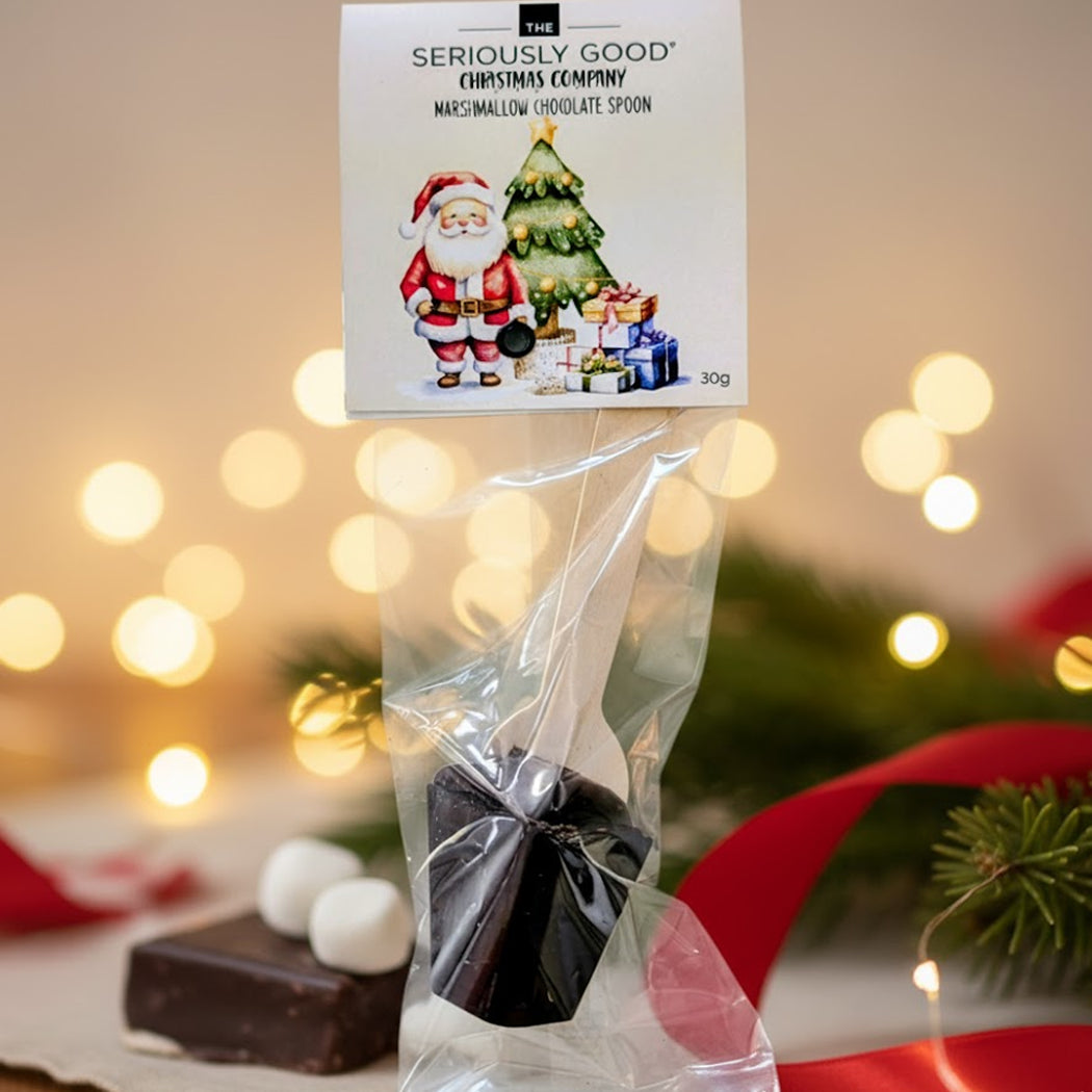 Chocolate spoon in a clear bag with a Christmas-themed label against a festive background