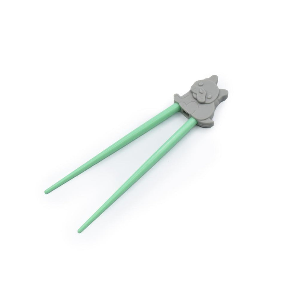 Green chopsticks with a gray panda-shaped holder on a white background