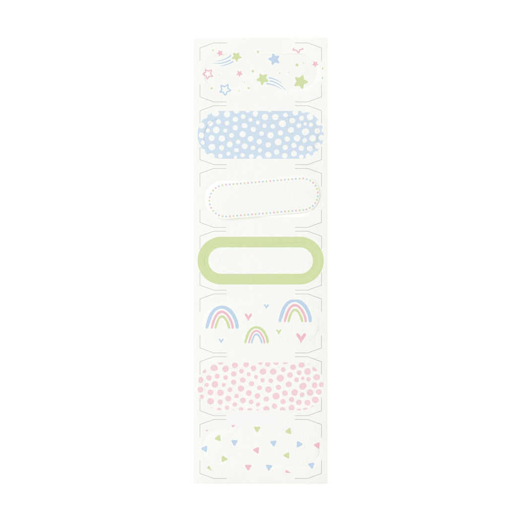 A sheet of decorative washi tape with various pastel patterns including stars, polka dots, rainbow motifs, and triangles in light blue, pink, green, and yellow on a white background.