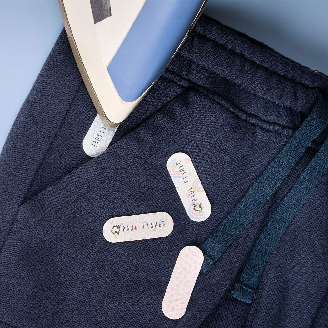 Navy fabric with iron and ironing labels on a blue background