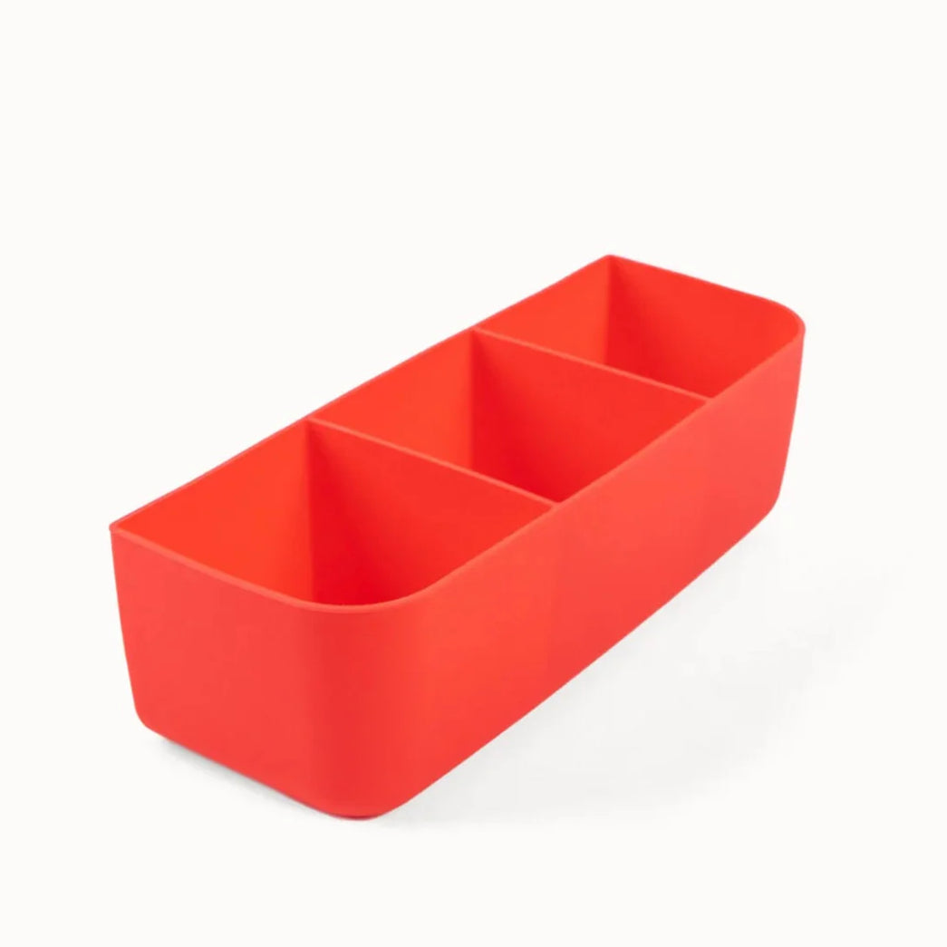 Red rectangular container with compartments on a white background