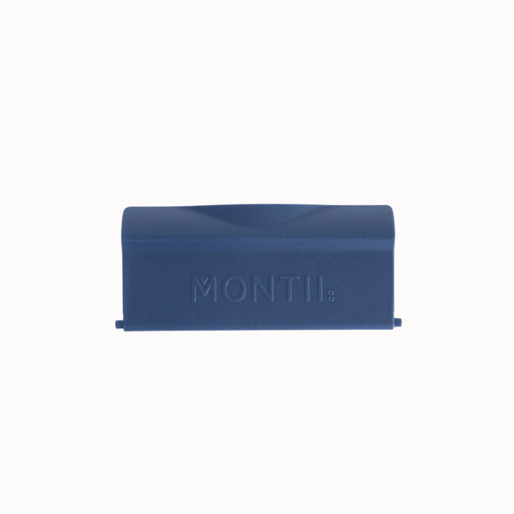 Navy rectangular replacement feast lunchbox latch with 'MONTII' branding on a white background