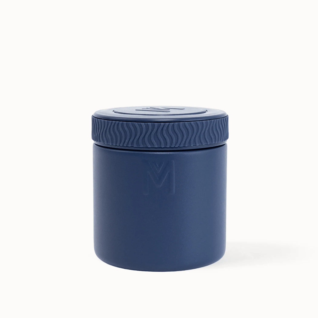 Navy blue container with lid on a white background