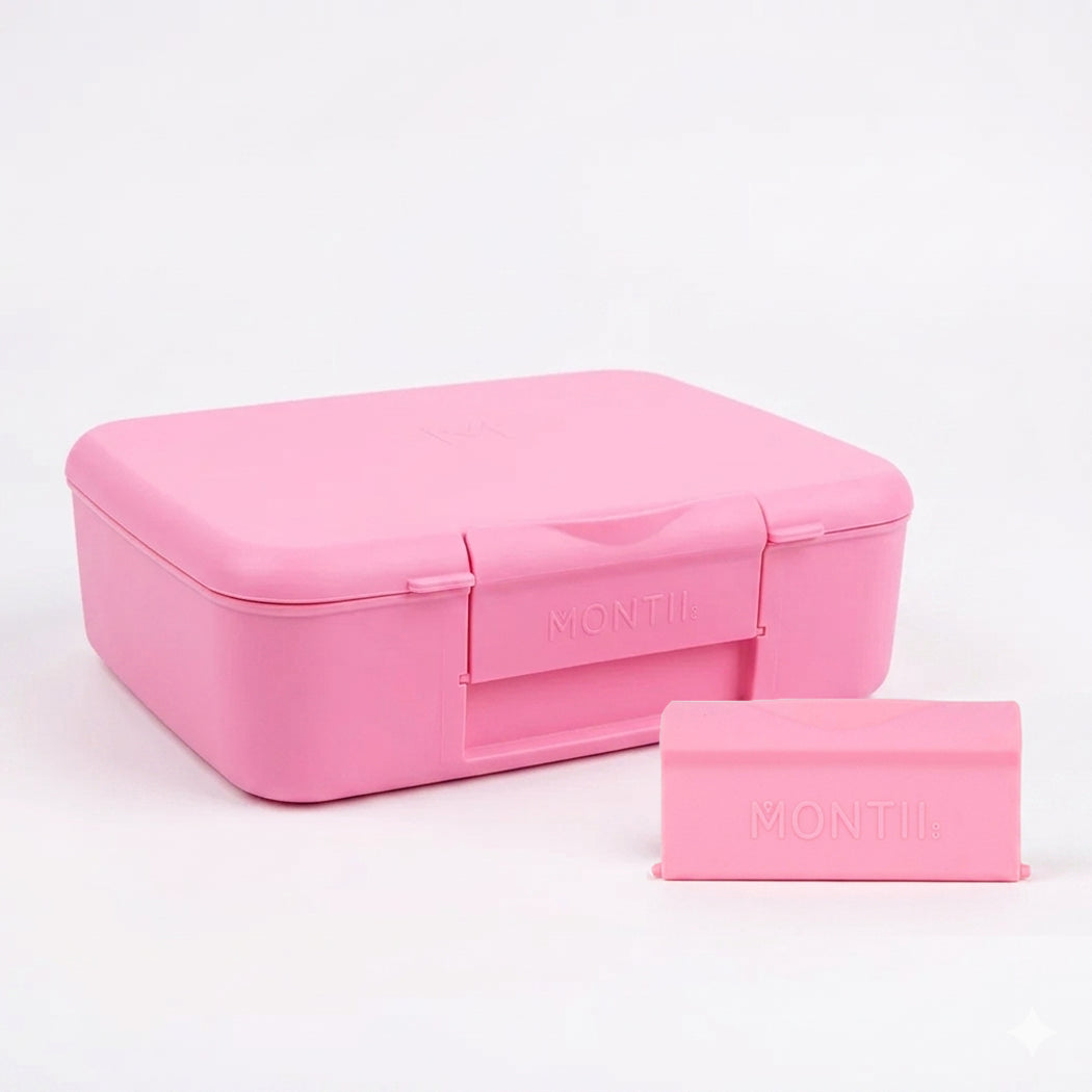 Pink lunch box with a smaller pink container on a white background