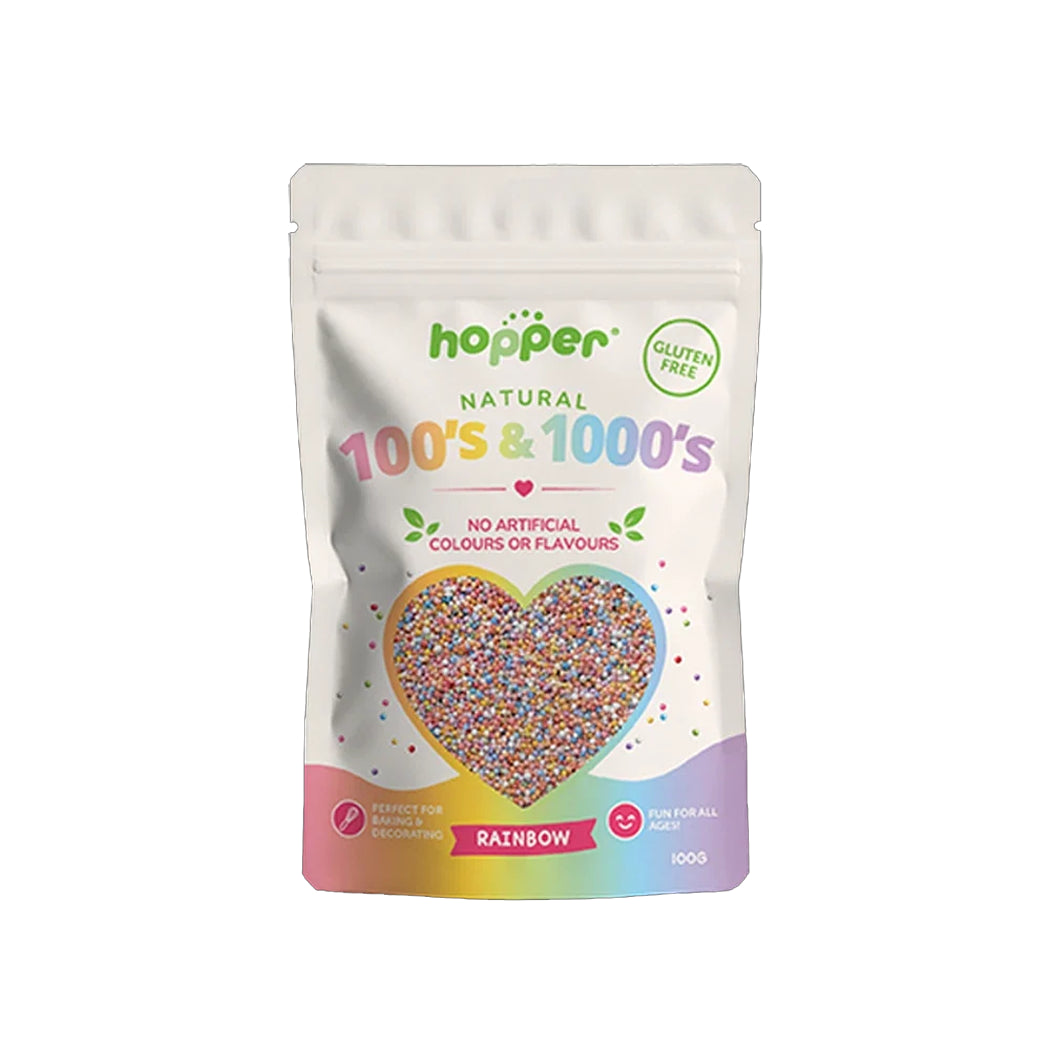 A stand-up pouch of Hopper Natural 100's & 1000's sprinkles in the Rainbow flavor, featuring a heart-shaped window showing the colorful sprinkles inside.
