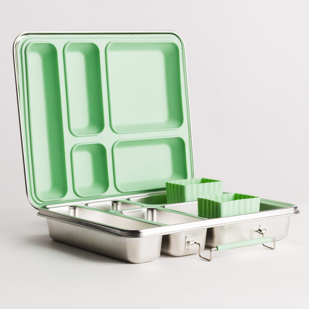 A stainless steel bento lunch box with a mint green interior and matching compartment organizers, shown open on a light gray background.