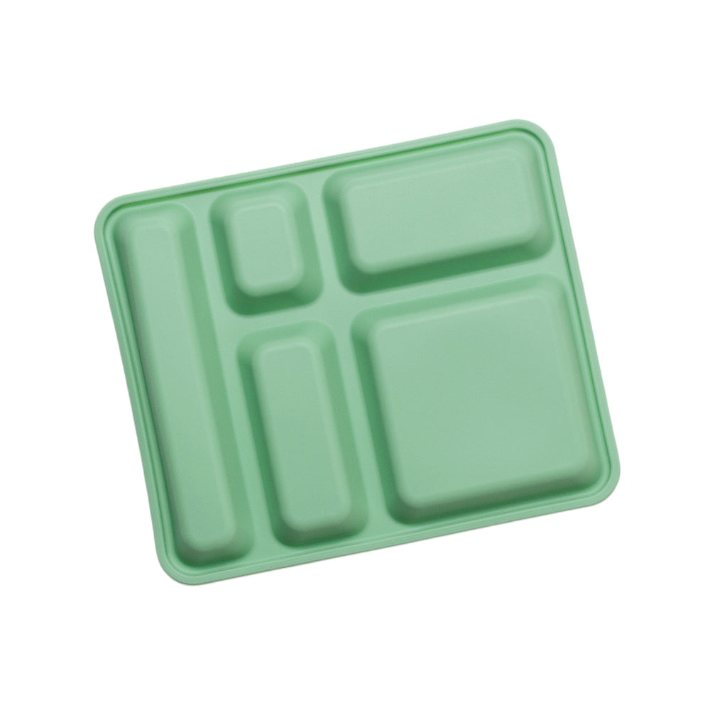 Green plastic tray with compartments on a white background