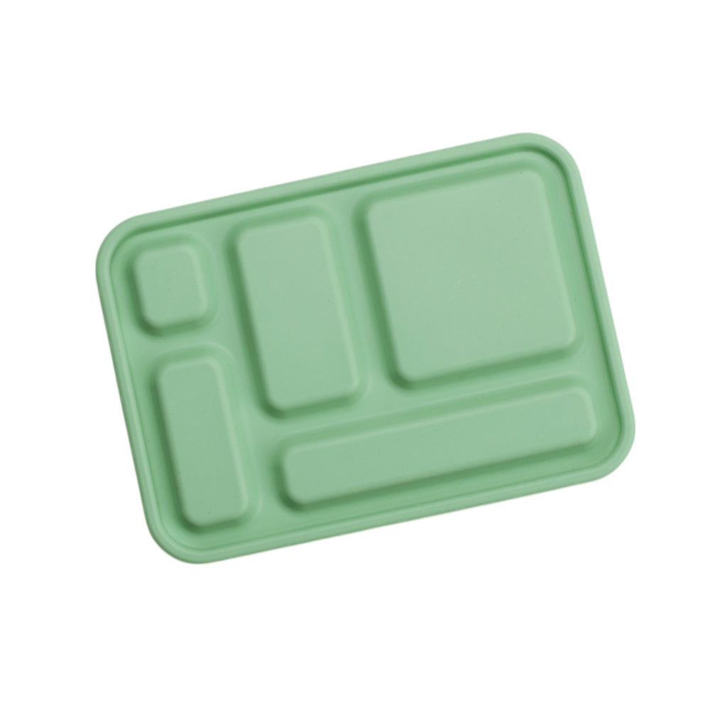Green plastic tray with compartments on a white background