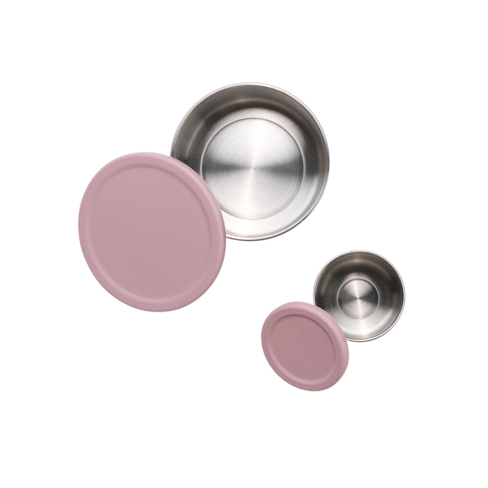 Set of pink and silver lids on a white background