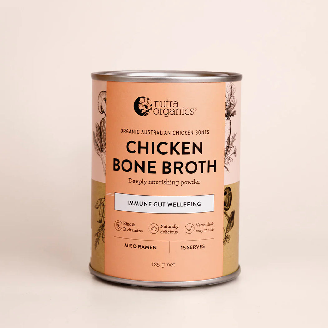 Can of Nutra Organics Chicken Bone Broth on a beige background