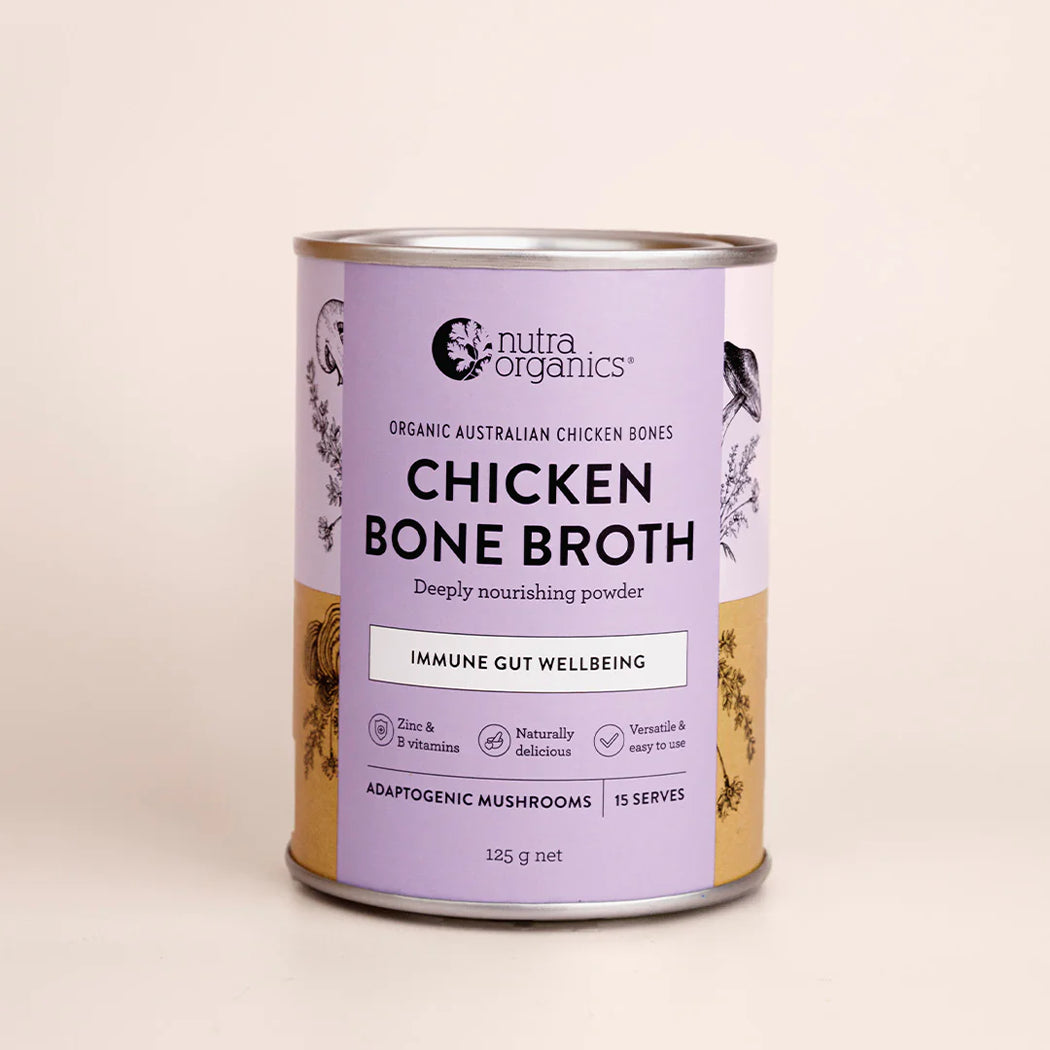 Can of Nutra Organics Chicken Bone Broth on a beige background