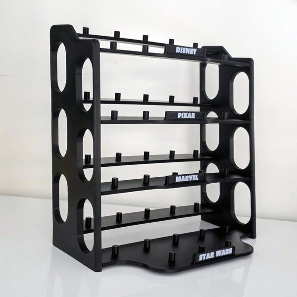 A black plastic multi-level display stand with cutout side panels and branded slots for Disney, Pixar, Marvel, and Star Wars, shown on a white studio background.