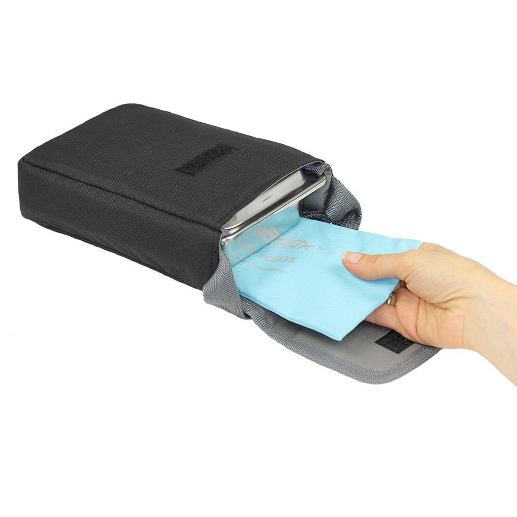 A black and gray passport holder pouch with a hand sliding a light blue passport insert into the slot, shown against a plain white background.