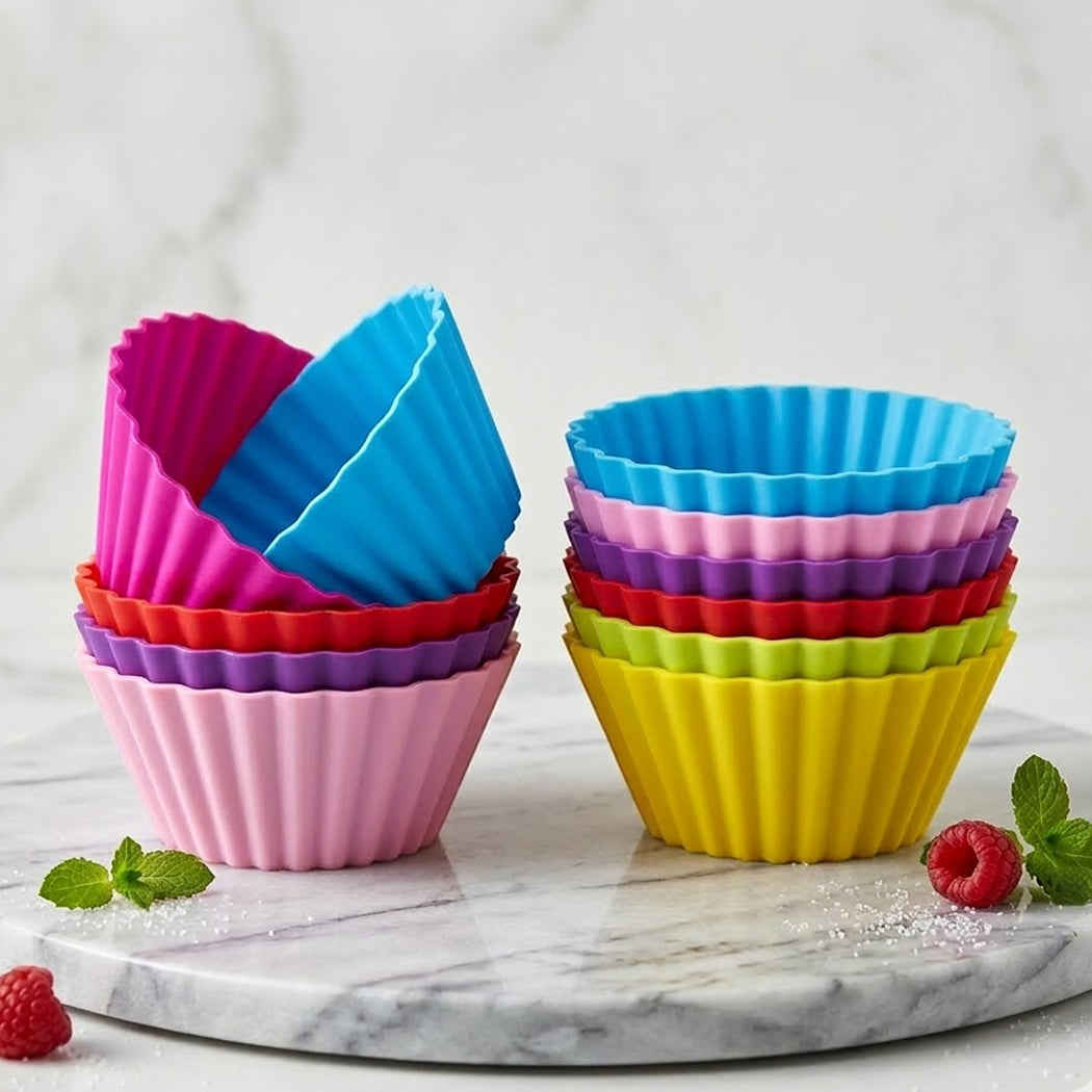 Colorful silicone baking cups on a marble surface with a light background