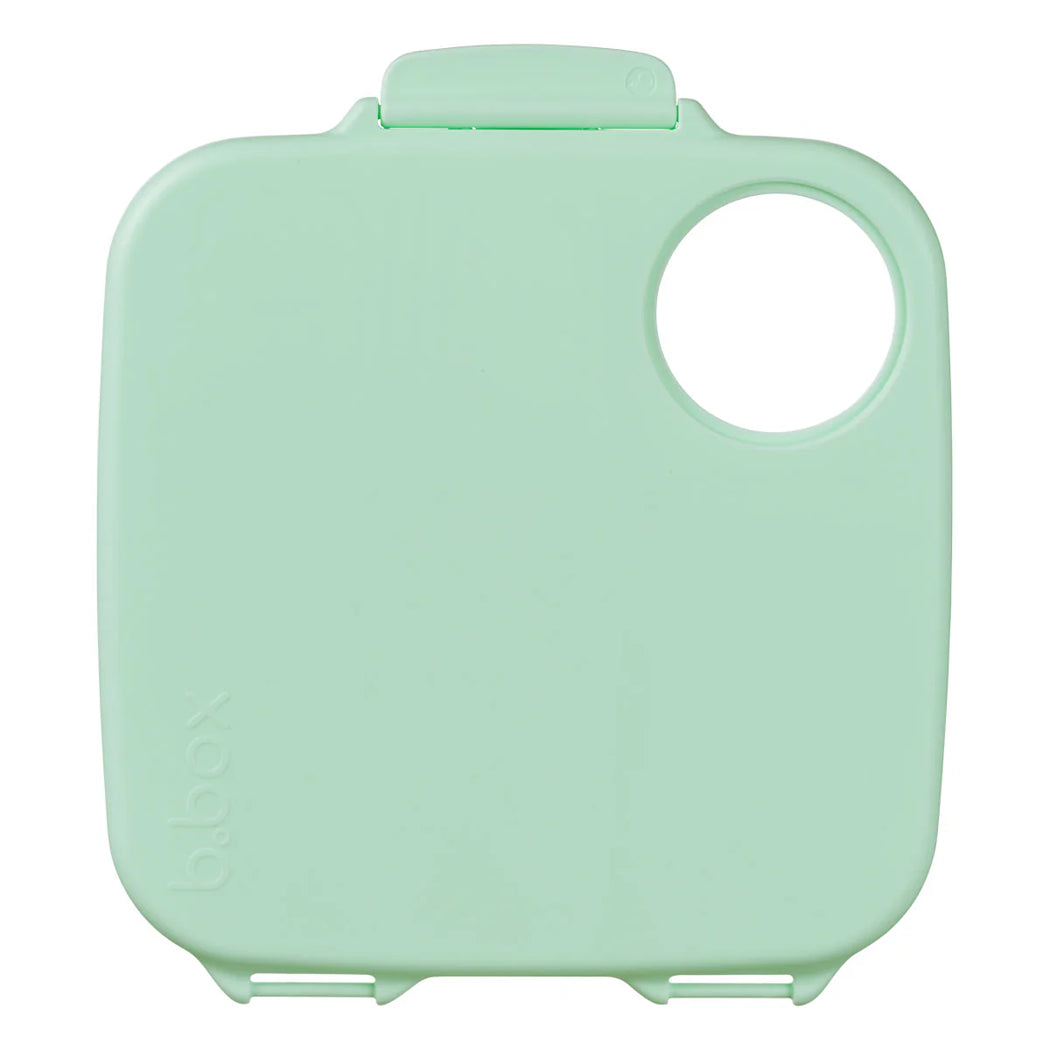 Mint green plastic container lid on a white background