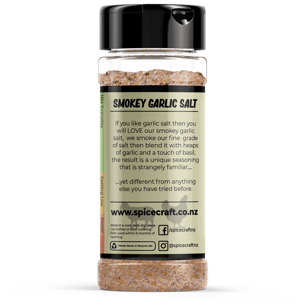 Shaker of smoky garlic salt with label on a white background