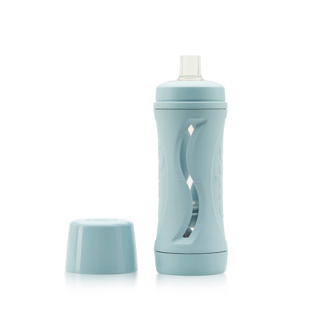 Light blue water bottle with a matching cap on a white background
