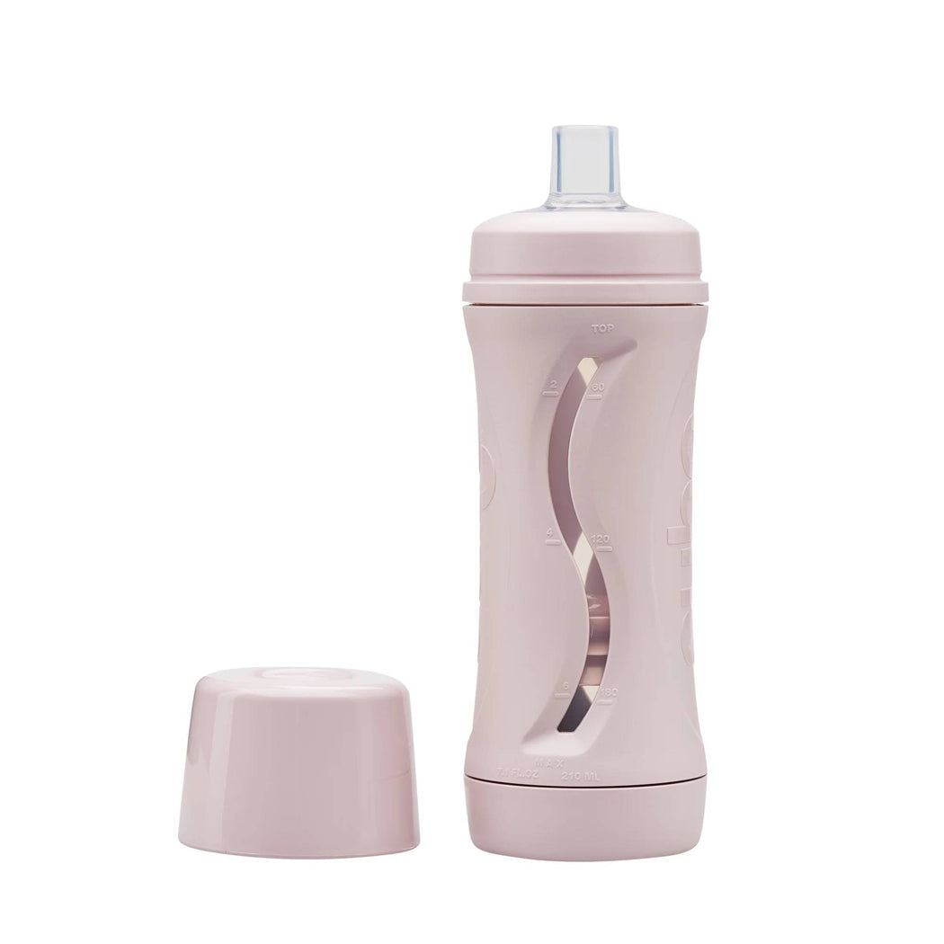 Pink water bottle with a clear lid on a white background