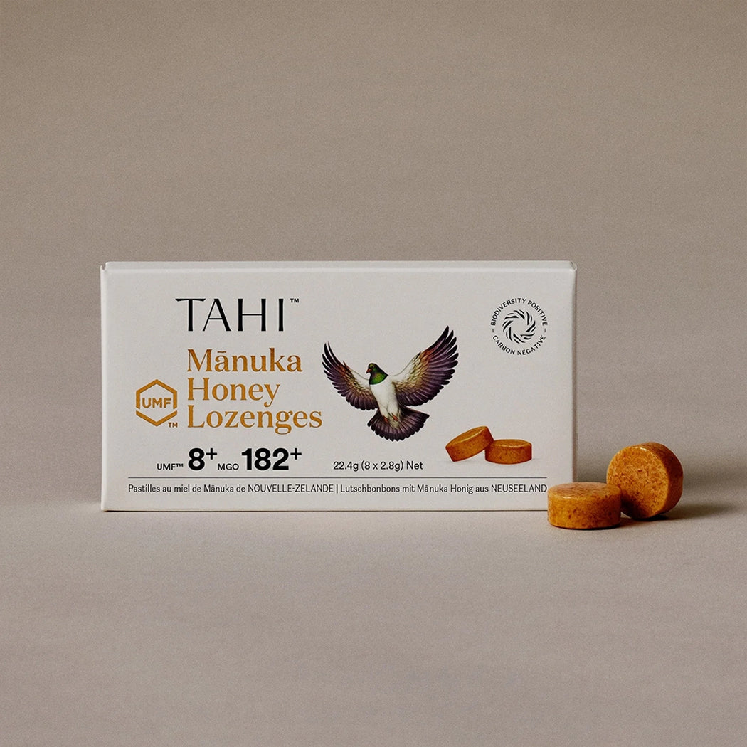 Box of Tahi Manuka Honey Lozenges with honey lozenges on a beige background