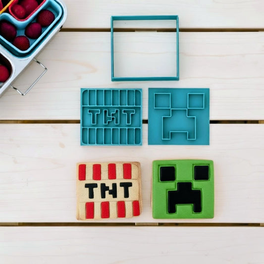 Toy figures and cookie cutters on a light wooden background