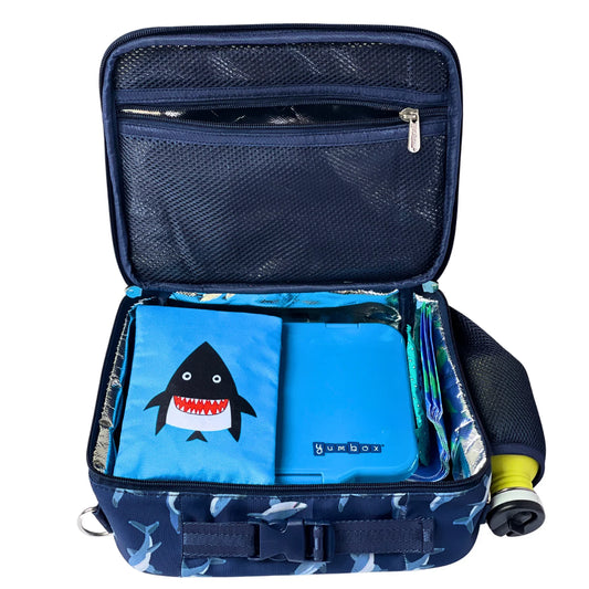 Navy blue cooler bag with shark design on a white background