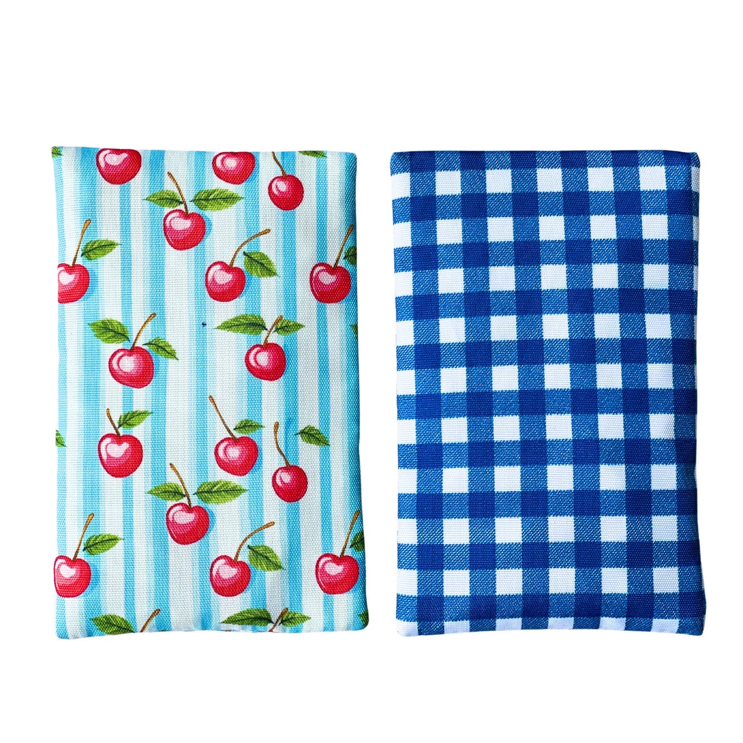 Two fabric towels, one with cherry pattern and blue stripes, the other with blue and white checkered pattern.